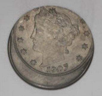 1907 Liberty nickel off-center strike error showing shifted design and blank planchet crescent