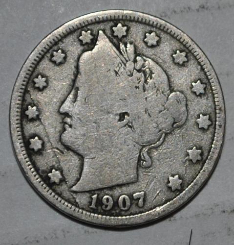1907 Liberty nickel lamination error showing planchet surface delamination and separated metal flap